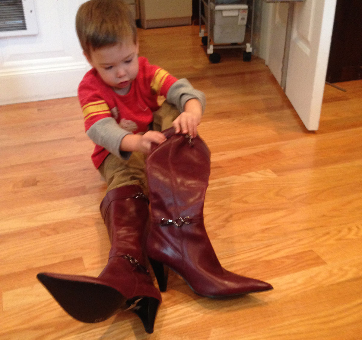 Loa's nephew tries on her boots